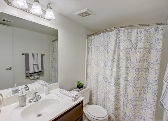 Bathroom with Vanity, Toilet & Shower with a curtain at Glen at Mesa Apartments, Mesa