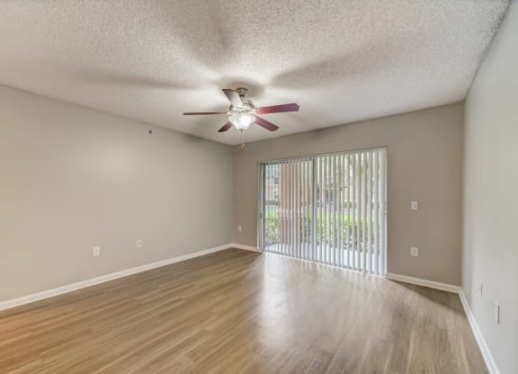 Living room with woodstyle floors and ceiling fan at Pembroke Pines Landings, Pembroke Pines, FL, 33025