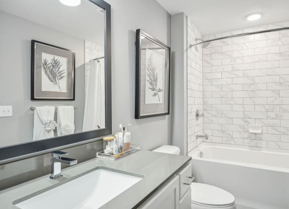 a white bathroom with a shower and a sink at Edge75, Naples, Florida 34104