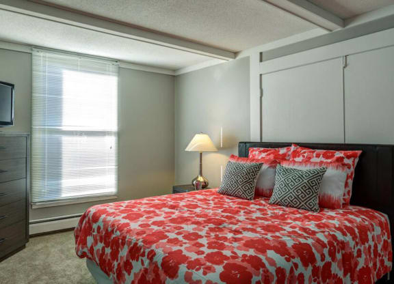 bed with orange at Glen at Burnsville, Burnsville Minnesota