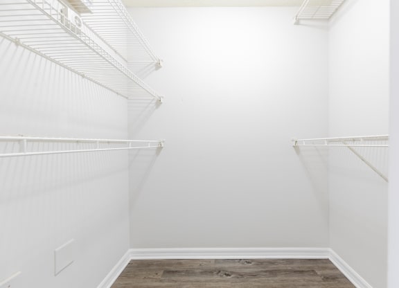 a walk in closet in a 555 waverly unit at Heritage Bay, Jensen Beach, FL