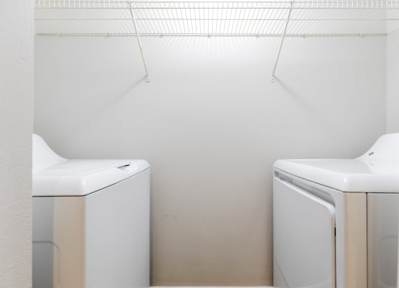 a washer and dryer in a laundry room at Heritage Bay, Jensen Beach Florida