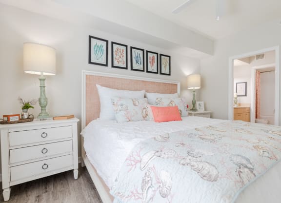a bedroom with a bed and two night stands at Heritage Bay, Florida