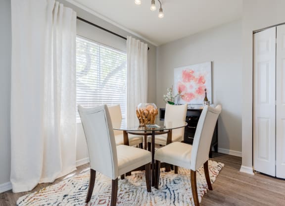a dining room with a table and chairs at Heritage Bay, Jensen Beach Florida
