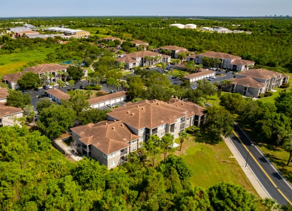 arial view of a subdivision with houses and trees at Heritage Bay, Florida, 34957