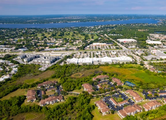 an aerial view of a city with a body of water in the background at Heritage Bay, Jensen Beach, FL