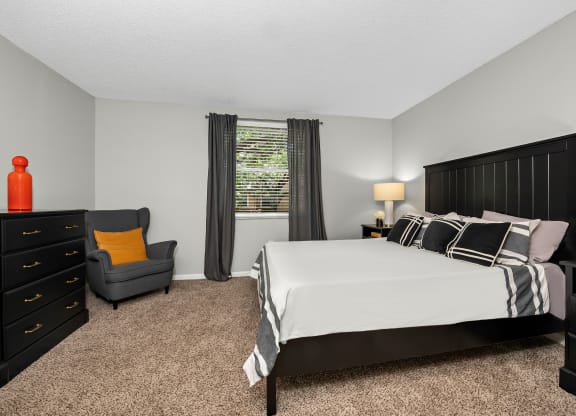 an image of a bedroom with a bed and a chair at Pembroke Pines Landings, Pembroke Pines