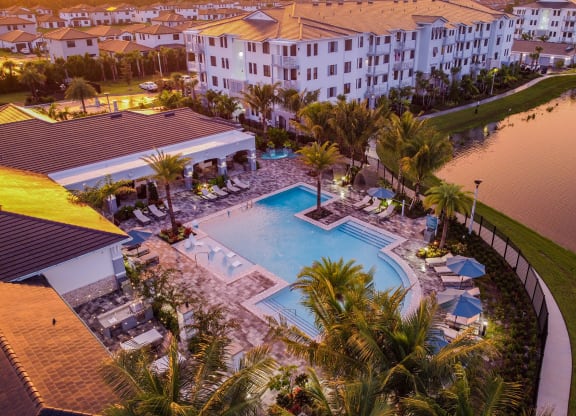 Aerial View of Community Lake and Pool at Sunset at Edge75, Naples