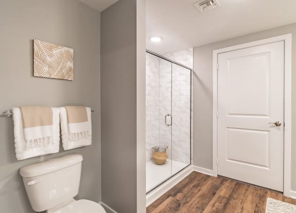 Bathroom with Wood Style Flooring at Edge75, Naples, FL