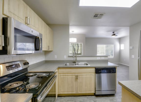 Chef-Inspired Kitchens Feature Stainless Steel Appliances at Sweetwater At Metro North Apartments, Phoenix, AZ 85029