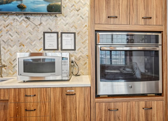 a kitchen with a microwave and a toaster oven at Riverwalk Apartments, Lawrence, MA