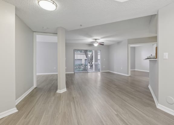the living room and dining room of an empty apartment at Pembroke Pines Landings, Pembroke Pines, Florida, 33025
