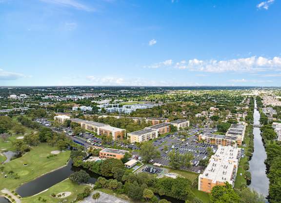an aerial view of a city with a river and buildings at Cypress Grove, Lauderhill, 33313