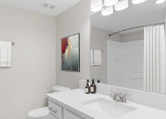 a white bathroom with a sink and a mirror at Lakeside Villas, Orlando, 32817