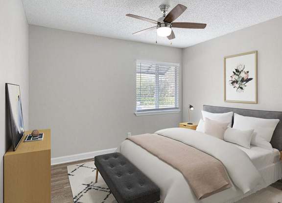 a bedroom with a bed and a ceiling fan at Lakeside Villas, Orlando