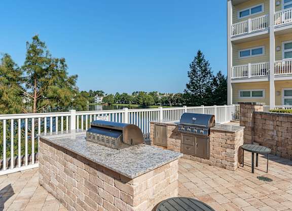 barbecue grill and seating area at Lake Lofts at Deerwood, Florida, 32216