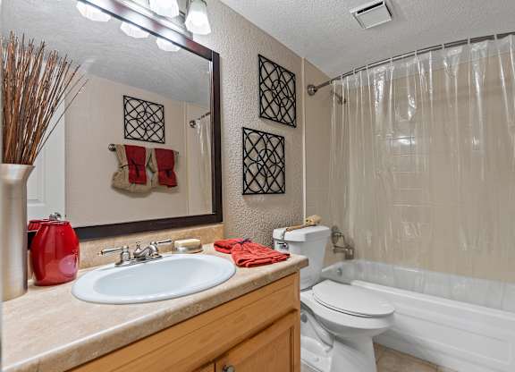 a bathroom with a sink toilet and tub and a shower at Oak Reserve at Winter Park, Florida, 32792