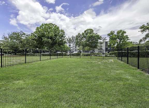 a large grassy area with a fence around it  at Club at Emerald Waters, Florida