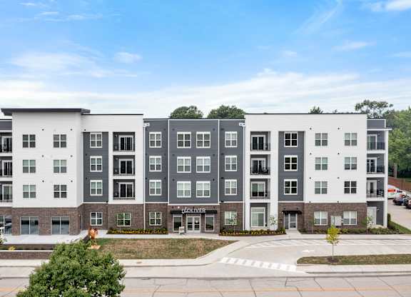 A modern apartment building with the name at The Oliver Apartments, Olivette