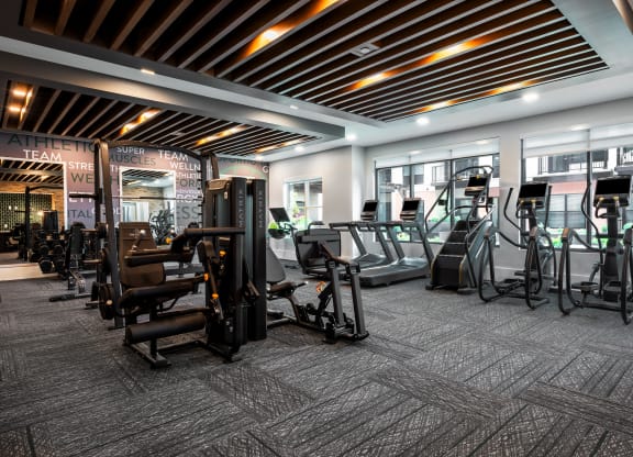 Large modern fitness center with cardio equipment and strength training machines  at Chapter at the Streets of St Charles, Saint Charles, MO, 63303