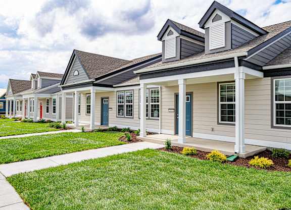 A row of houses with blue doors and windows at French District Villas Apartments, St. Charles, Missouri