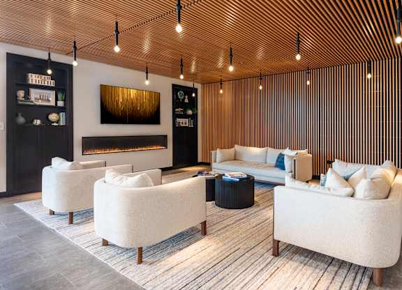 A modern living room with a fireplace and a sofa.