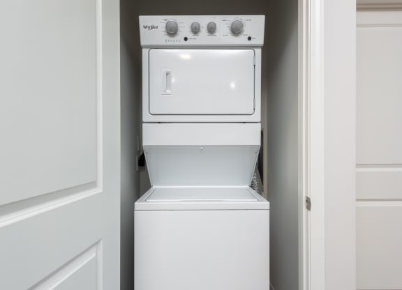 Full-size stackable washer and dryer in unit  at Chapter at the Streets of St Charles, Saint Charles, Missouri