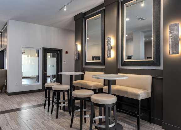 A modern bar area with a black and white color scheme.