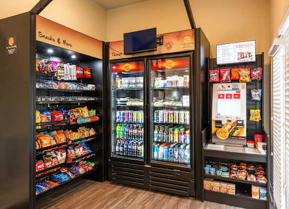 A snack and drink vending machine with a variety of items.