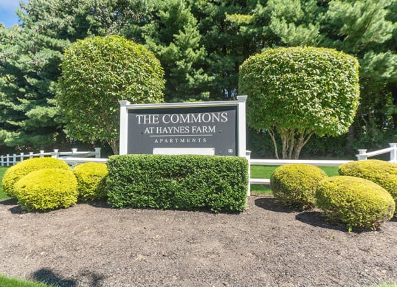 Monument Sign and Front Entrance at The Commons at Haynes Farm Apartments in Boston, MA.