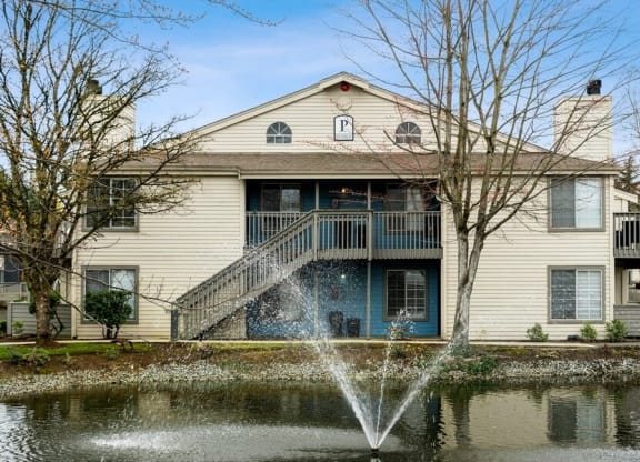 Exterior view of apartments near lake with fountain