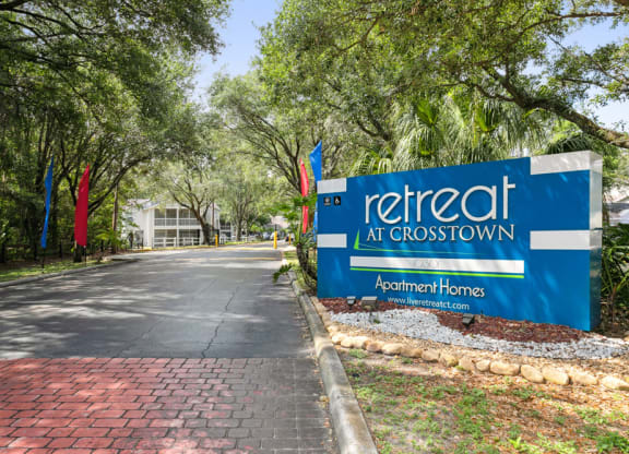 Retreat at Crosstown Apartments sign at entry