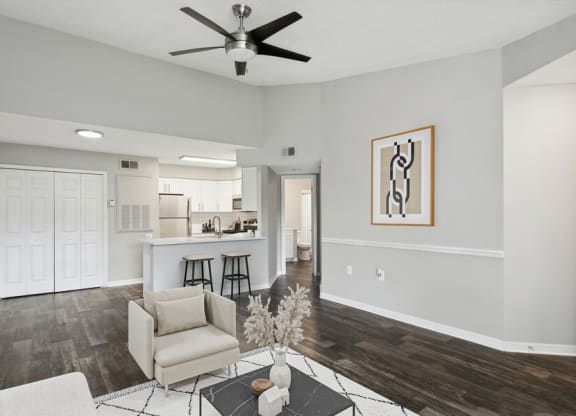 Model living room with view of kitchen