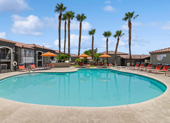 Community Swimming Pool with Pool Furniture at Loma Vista Apartments in Las Vegas, NV.