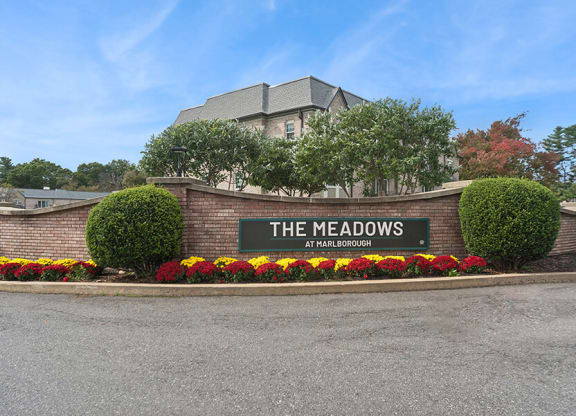 Community Monument Sign and Landscape at Meadows at Marlborough Apartments located in Marlborough, MA.