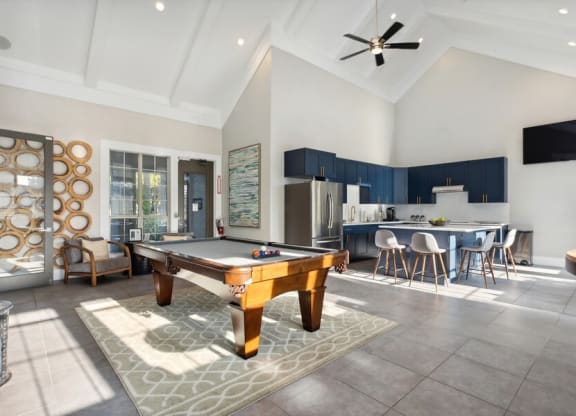 Clubhouse Pool Table and Kitchen at Caribbean Breeze Apartments in Tampa, FL.