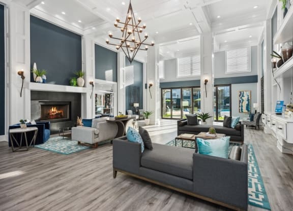 Community lounge with fireplace at Park West Apartments in Houston, Texas