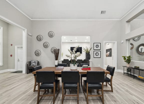 Community Clubhouse with Lounge Furniture at Bridges at Oakbend Apartments located in Lewisville, TX.