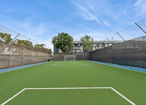 Community Soccer Field with Nets at Madison Park Apartments located in Anaheim, CA.