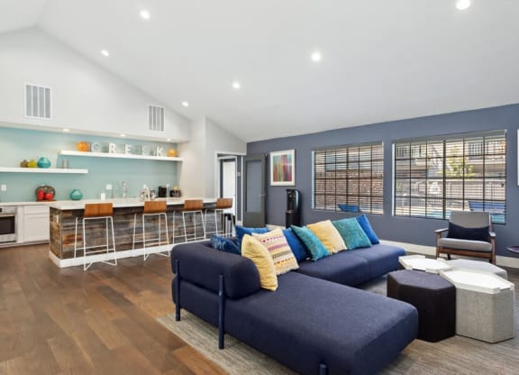 Community Clubhouse with Island Bar and Lounge Furniture at Creek 2645 Apartments in Sacramento, CA.