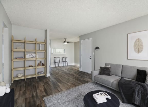 Model living room with view of kitchen bar