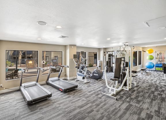 Community Fitness Center with Equipment at Saddle Ridge Apartments in Tucson, AZ.