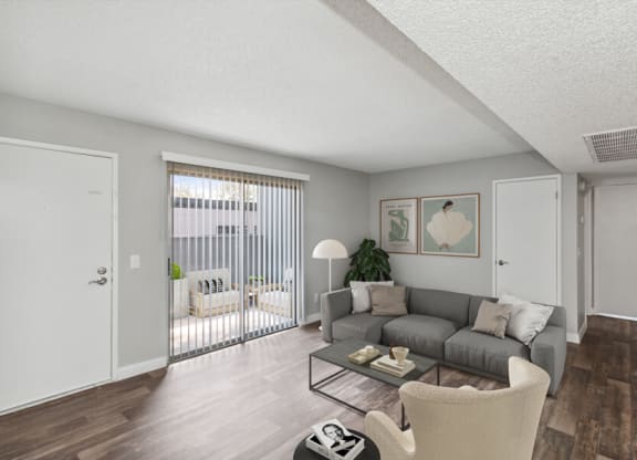 Model living room of an apartment with a couch and a coffee table