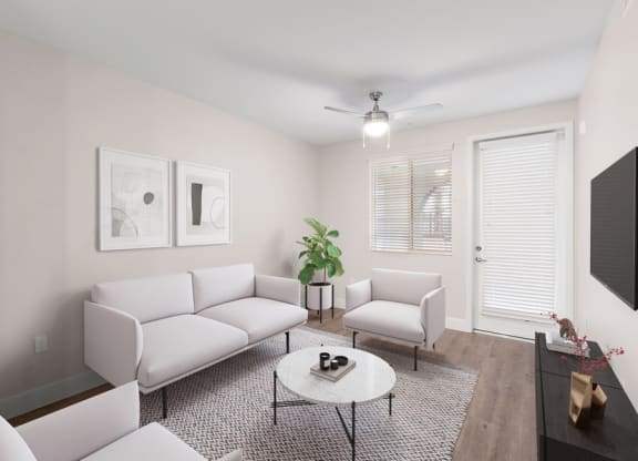 Model living room space with door to patio/balcony
