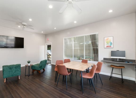 Community Clubhouse with Lounge Furniture & Work Stations at Indigo Park Apartments located in Albuquerque, NM.
