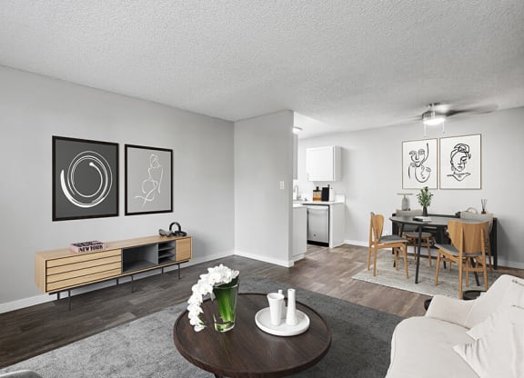 Model Living Room with Carpet and Wood-Style Flooring at The Archer Apartments in Sacramento, CA.
