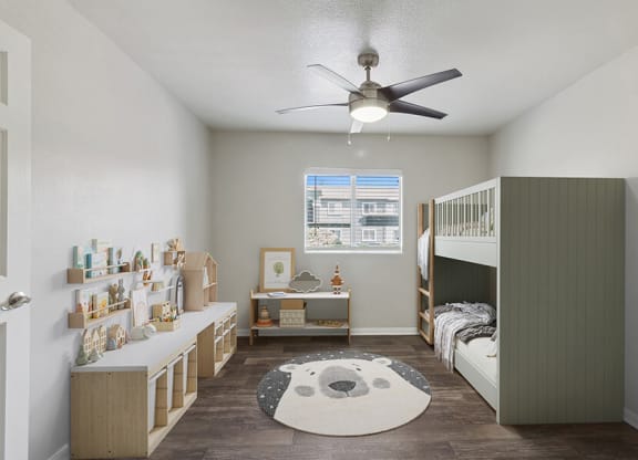 Model Bedroom with Wood-Style Flooring and Window View at Loma Vista Apartments in Las Vegas, NV.