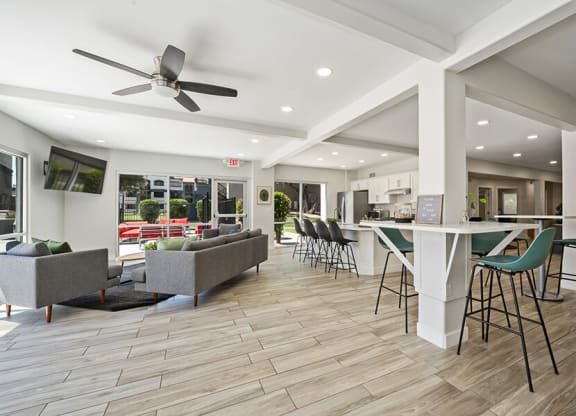 Community Clubhouse with Lounge Furniture and Kitchenette Area at Country Club Verandas Apartments located in Mesa, AZ.