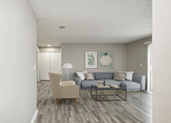 Model living room with chairs and sofa