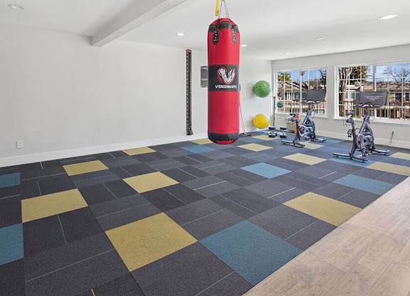 Community Fitness Center with Equipment at Los Gatos Landing Apartments located in San Jose, CA.
